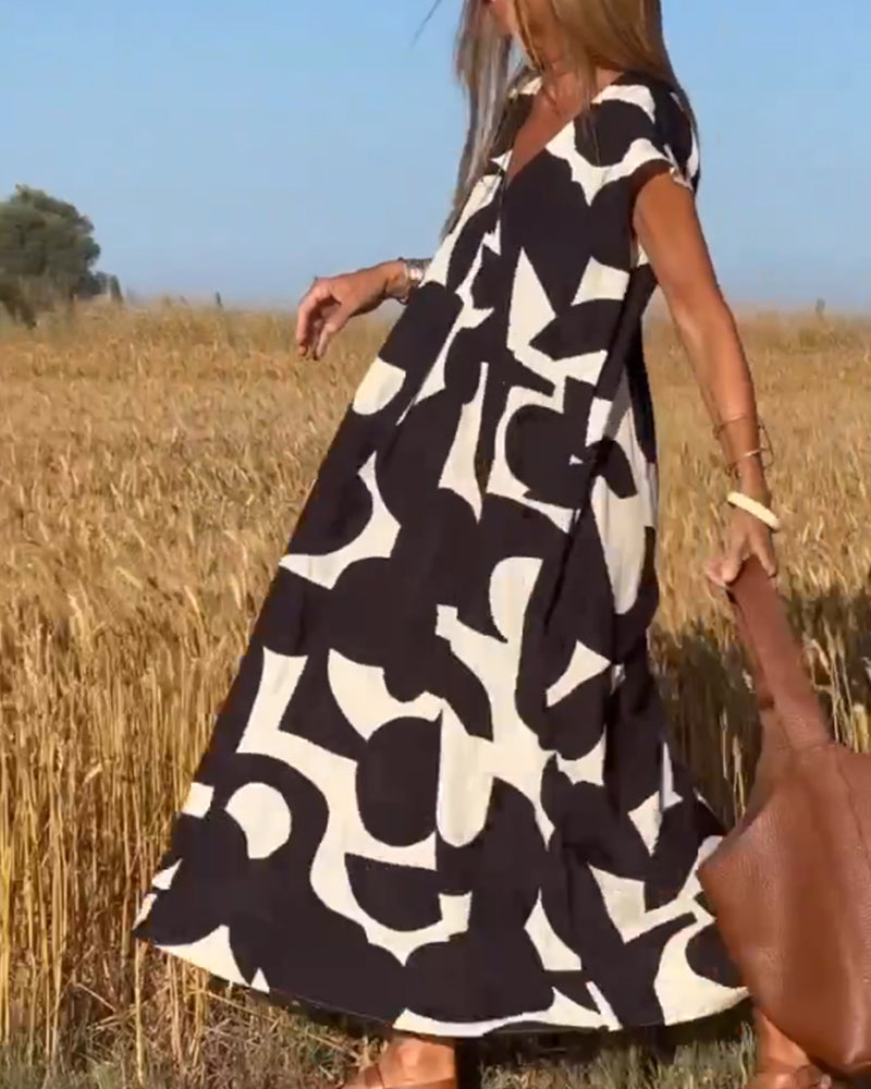 סיטה | שמלה מודפסת עם צווארון V